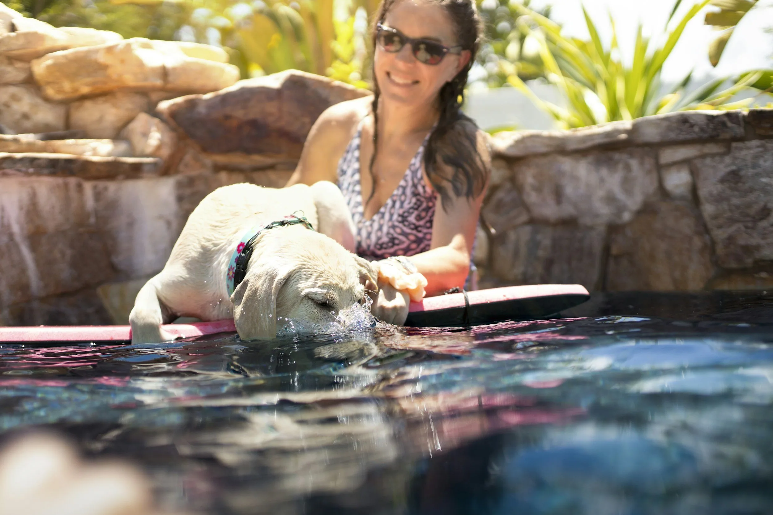 Happy homeowner with a professionally maintained  swimming pool