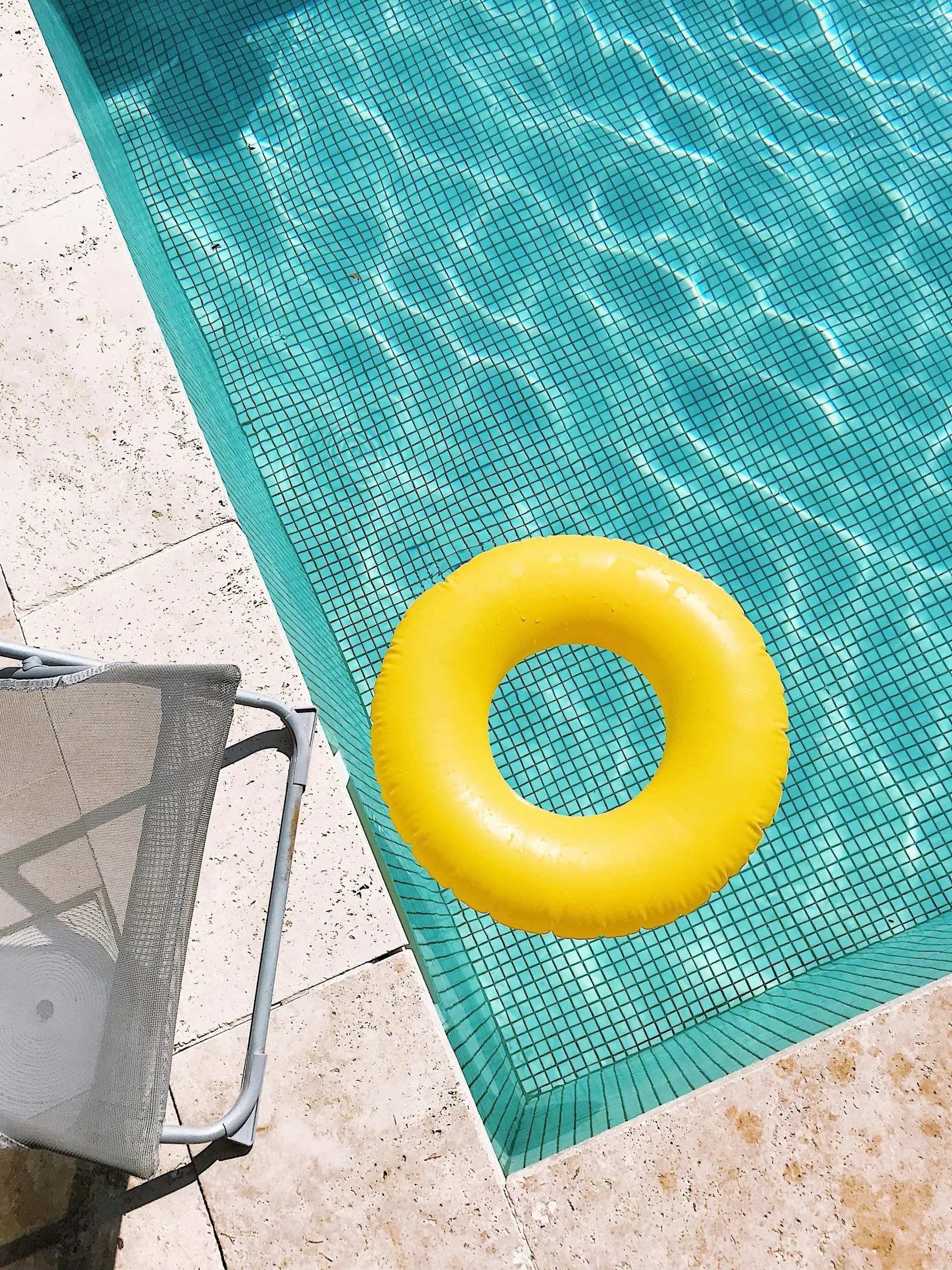 Crystal clear swimming pool water in an Arkansas backyard
