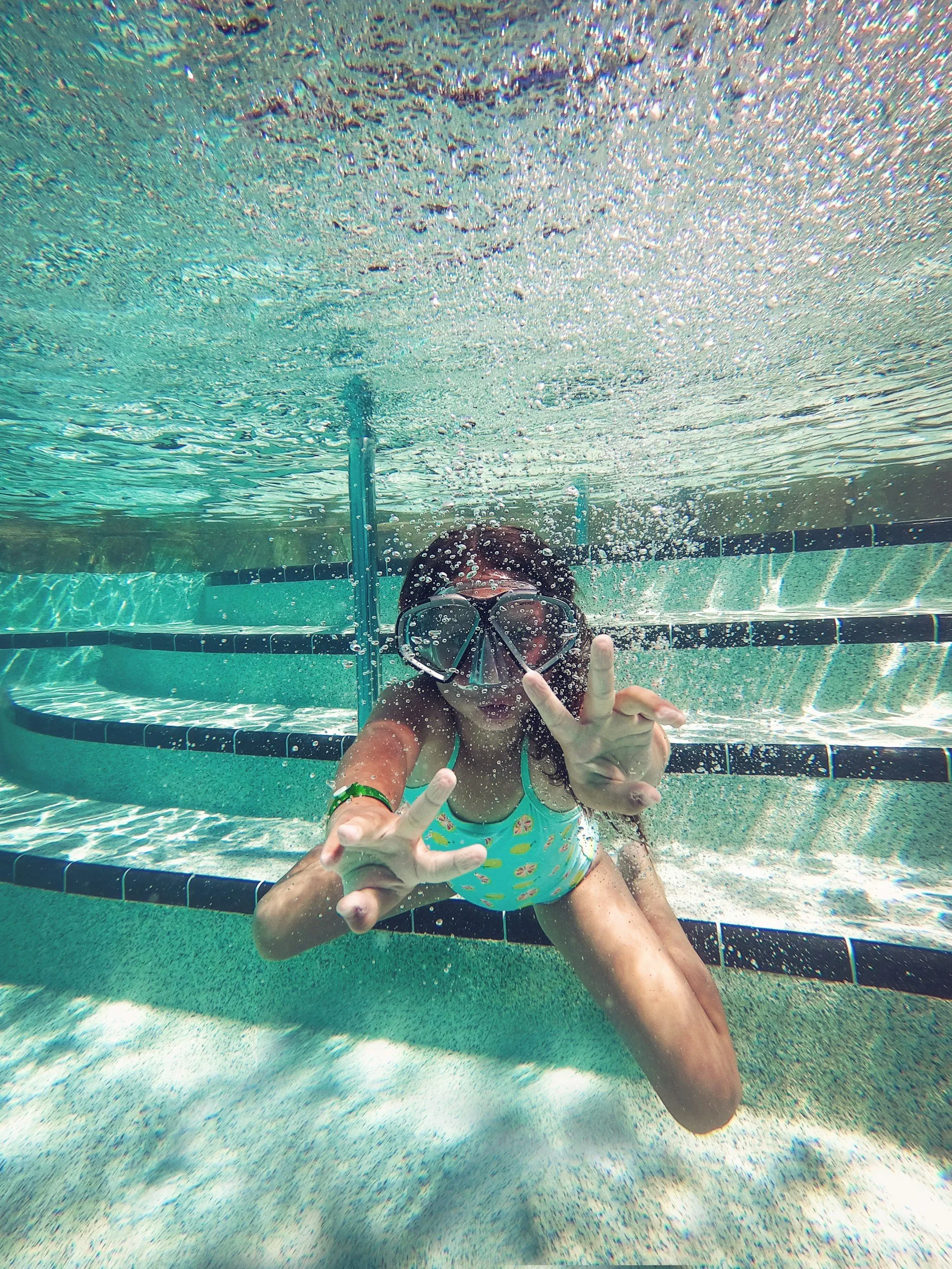 Homeowner relaxing by a well-maintained backyard pool in  Central Arkansas